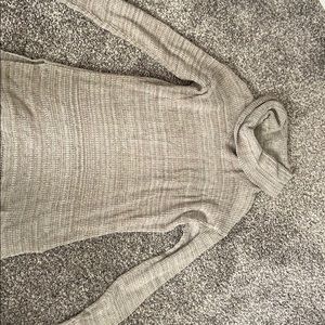 Neutral color sweater.